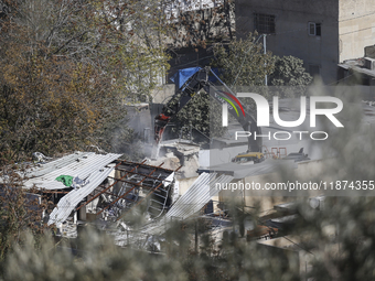 Jerusalem Municipality Machinery Demolished 11 Residential And Commercial Structures Today, December 16, 2024, In The Town Of Silwan, South...