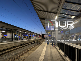 Pasing Station in Munich, Bavaria, Germany, on December 16, 2024, serves the daily rhythm of commuters and travelers. Passengers wait on the...