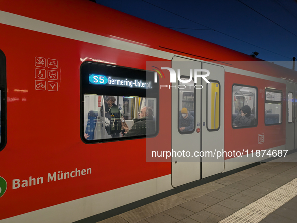 Passengers are aboard the S5 suburban train bound for Germering-Unterpfaffenhofen in Munich, Bavaria, Germany, on December 16, 2024. The S5...