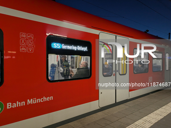 Passengers are aboard the S5 suburban train bound for Germering-Unterpfaffenhofen in Munich, Bavaria, Germany, on December 16, 2024. The S5...