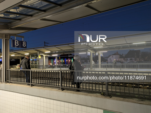 Pasing Station in Munich, Bavaria, Germany, on December 16, 2024, serves the daily rhythm of commuters and travelers. Passengers wait on the...