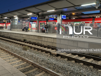 Pasing Station in Munich, Bavaria, Germany, on December 16, 2024, serves the daily rhythm of commuters and travelers. Passengers wait on the...