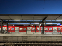 A suburban S-Bahn train waits at Munich Pasing Station in Bavaria, Germany, on December 16, 2024. The station's architecture, with modern st...