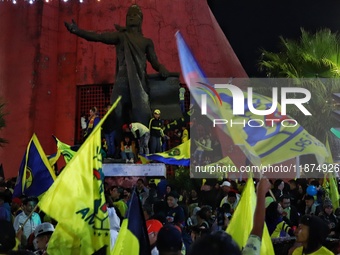 Hundreds of Club America fans attend the Coyote Monument in Ciudad Nezahualcoyotl to celebrate after Club America wins the first three-time...