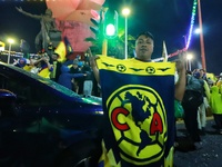 Hundreds of Club America fans attend the Coyote Monument in Ciudad Nezahualcoyotl to celebrate after Club America wins the first three-time...