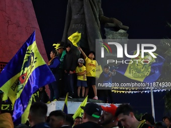 Hundreds of Club America fans attend the Coyote Monument in Ciudad Nezahualcoyotl to celebrate after Club America wins the first three-time...