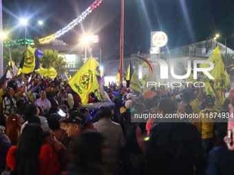 Hundreds of Club America fans attend the Coyote Monument in Ciudad Nezahualcoyotl to celebrate after Club America wins the first three-time...