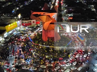 Hundreds of Club America fans attend the Coyote Monument in Ciudad Nezahualcoyotl to celebrate after Club America wins the first three-time...