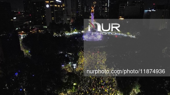 Hundreds of Club America fans attend the Angel de la Independencia Monument to celebrate after Club America wins the first three-time champi...