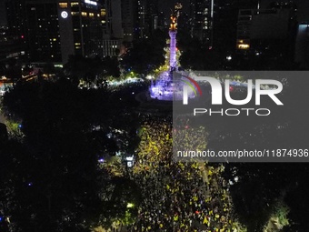 Hundreds of Club America fans attend the Angel de la Independencia Monument to celebrate after Club America wins the first three-time champi...