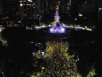 Hundreds of Club America fans attend the Angel de la Independencia Monument to celebrate after Club America wins the first three-time champi...