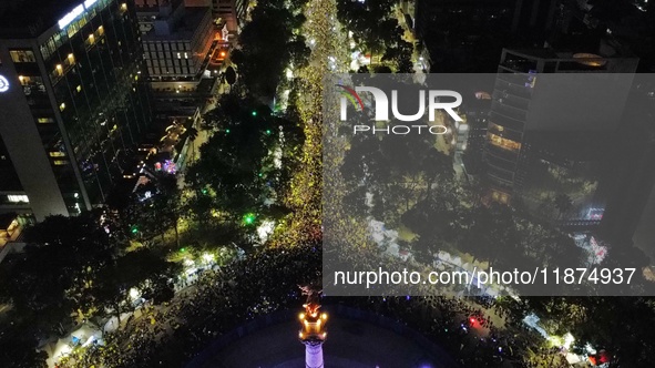 Hundreds of Club America fans attend the Angel de la Independencia Monument to celebrate after Club America wins the first three-time champi...