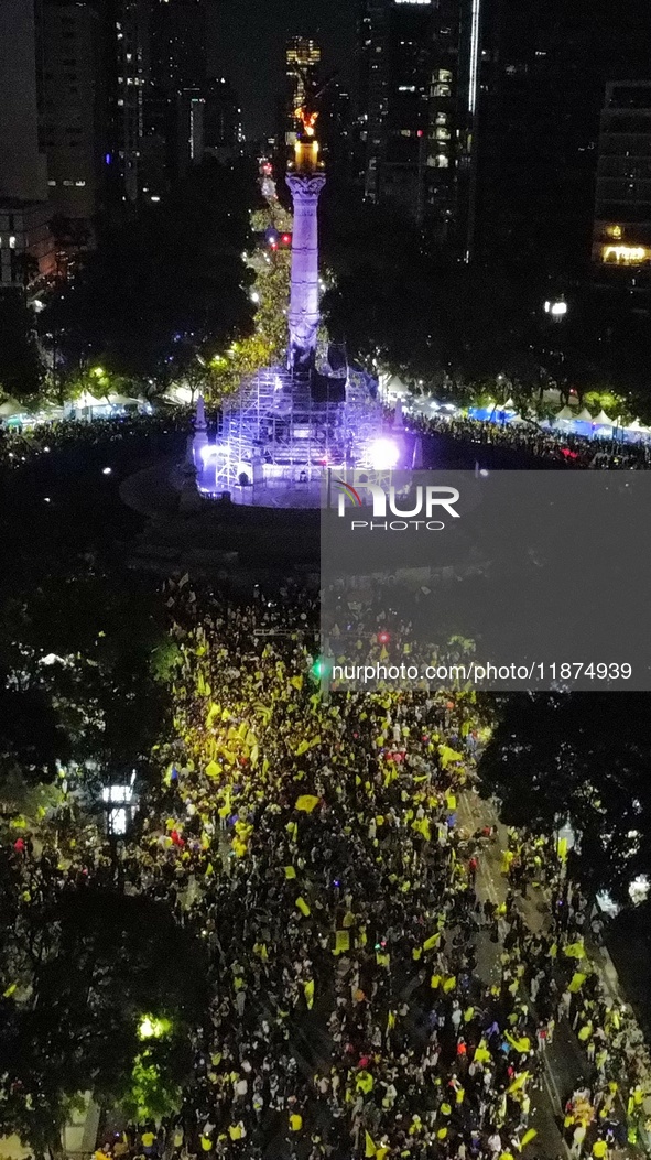 Hundreds of Club America fans attend the Angel de la Independencia Monument to celebrate after Club America wins the first three-time champi...