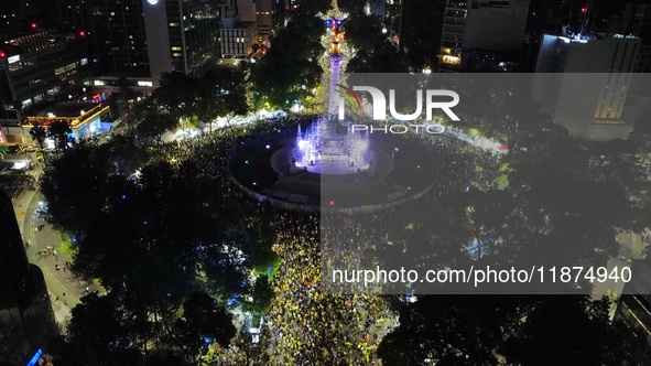 Hundreds of Club America fans attend the Angel de la Independencia Monument to celebrate after Club America wins the first three-time champi...