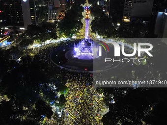 Hundreds of Club America fans attend the Angel de la Independencia Monument to celebrate after Club America wins the first three-time champi...