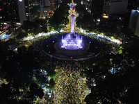 Hundreds of Club America fans attend the Angel de la Independencia Monument to celebrate after Club America wins the first three-time champi...