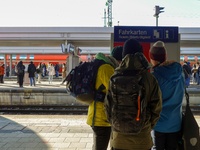 Passengers prepare for their journey at the Bavarian Alps hub. In Garmisch-Partenkirchen station, located in the Bavarian Alps, Germany, on...