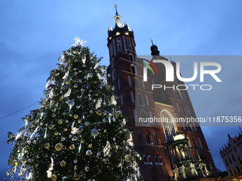 A view of the Christmas tree and St. Mary's Church at Main Square in Krakow, Poland on December 16, 2024. (