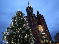 A view of the Christmas tree and St. Mary's Church at Main Square in Krakow, Poland on December 16, 2024. (