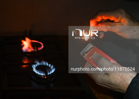 RZESZOW, POLAND - DECEMBER 16:
A person lights a match to ignite the natural gas burner of a natural-gas-burning stove, on December 16, 2024...