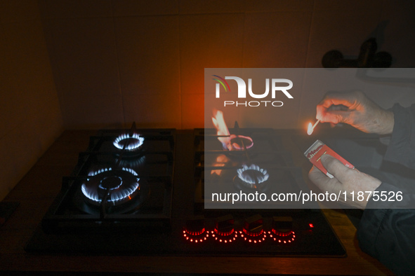 RZESZOW, POLAND - DECEMBER 16:
A person lights a match to ignite the natural gas burner of a natural-gas-burning stove, on December 16, 2024...