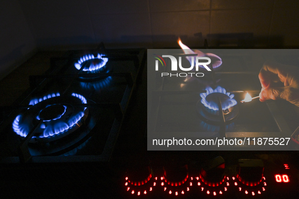 RZESZOW, POLAND - DECEMBER 16:
A person lights a match to ignite the natural gas burner of a natural-gas-burning stove, on December 16, 2024...