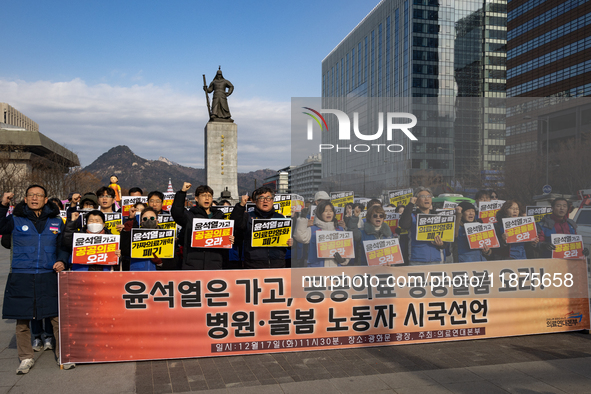 Healthcare and care workers hold a rally at Gwanghwamun Square in Seoul, South Korea, on December 17, 2024, calling for the strengthening of...