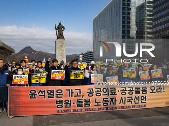 Healthcare and care workers hold a rally at Gwanghwamun Square in Seoul, South Korea, on December 17, 2024, calling for the strengthening of...