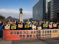 Healthcare and care workers hold a rally at Gwanghwamun Square in Seoul, South Korea, on December 17, 2024, calling for the strengthening of...