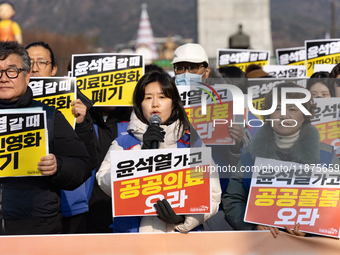 Healthcare and care workers hold a rally at Gwanghwamun Square in Seoul, South Korea, on December 17, 2024, calling for the strengthening of...