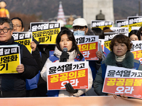 Healthcare and care workers hold a rally at Gwanghwamun Square in Seoul, South Korea, on December 17, 2024, calling for the strengthening of...