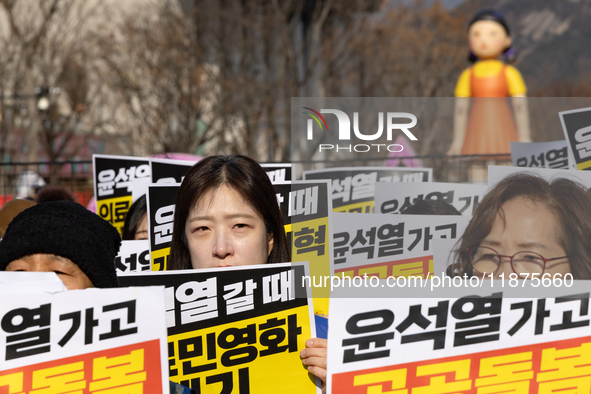 Healthcare and care workers hold a rally at Gwanghwamun Square in Seoul, South Korea, on December 17, 2024, calling for the strengthening of...