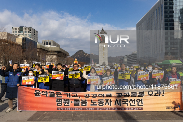 Healthcare and care workers hold a rally at Gwanghwamun Square in Seoul, South Korea, on December 17, 2024, calling for the strengthening of...