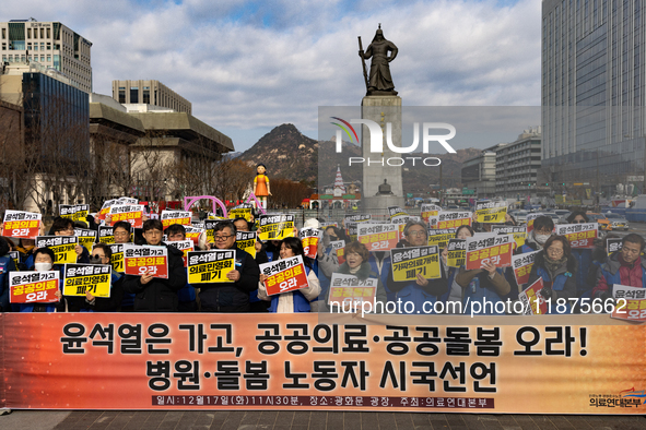 Healthcare and care workers hold a rally at Gwanghwamun Square in Seoul, South Korea, on December 17, 2024, calling for the strengthening of...