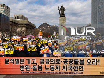 Healthcare and care workers hold a rally at Gwanghwamun Square in Seoul, South Korea, on December 17, 2024, calling for the strengthening of...