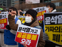 Healthcare and care workers hold a rally at Gwanghwamun Square in Seoul, South Korea, on December 17, 2024, calling for the strengthening of...