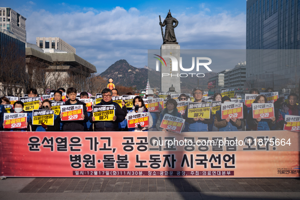 Healthcare and care workers hold a rally at Gwanghwamun Square in Seoul, South Korea, on December 17, 2024, calling for the strengthening of...