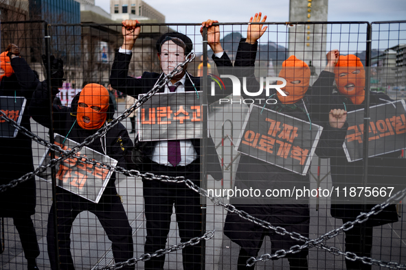 Officials from the Korean Health and Medical Workers' Union, under the Korean Confederation of Trade Unions Public Transport Workers' Union,...