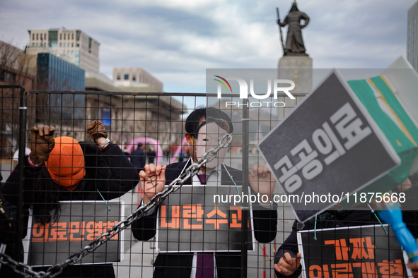 Officials from the Korean Health and Medical Workers' Union, under the Korean Confederation of Trade Unions Public Transport Workers' Union,...