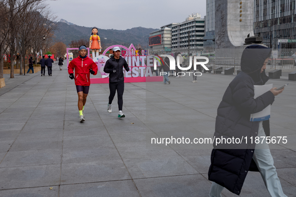 A 7-meter-tall statue of Young-hee, the iconic doll from the Netflix series Squid Game, is displayed at Gwanghwamun Square in Seoul, South K...