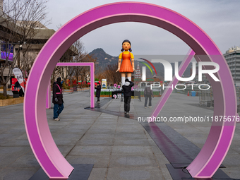 A 7-meter-tall statue of Young-hee, the iconic doll from the Netflix series Squid Game, is displayed at Gwanghwamun Square in Seoul, South K...