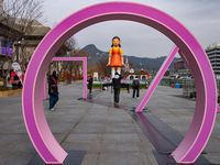 A 7-meter-tall statue of Young-hee, the iconic doll from the Netflix series Squid Game, is displayed at Gwanghwamun Square in Seoul, South K...