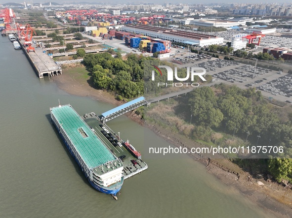 A ro-ro cargo ship loads Chery Group cars destined for the global market at Zhujiaqiao Port area of Anhui Port Group in Wuhu, Anhui province...