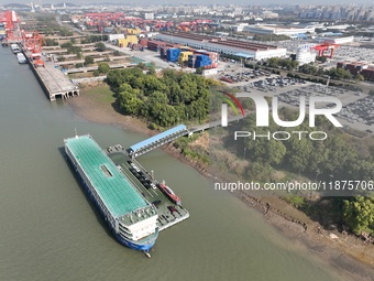 A ro-ro cargo ship loads Chery Group cars destined for the global market at Zhujiaqiao Port area of Anhui Port Group in Wuhu, Anhui province...