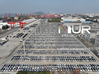 A ro-ro cargo ship loads Chery Group cars destined for the global market at Zhujiaqiao Port area of Anhui Port Group in Wuhu, Anhui province...