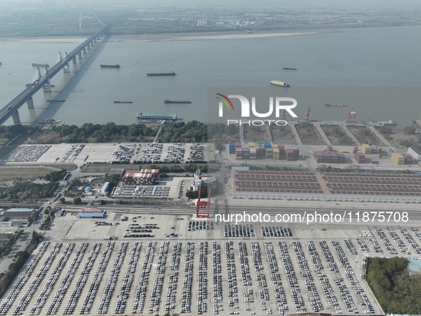 A ro-ro cargo ship loads Chery Group cars destined for the global market at Zhujiaqiao Port area of Anhui Port Group in Wuhu, Anhui province...