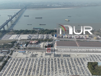 A ro-ro cargo ship loads Chery Group cars destined for the global market at Zhujiaqiao Port area of Anhui Port Group in Wuhu, Anhui province...