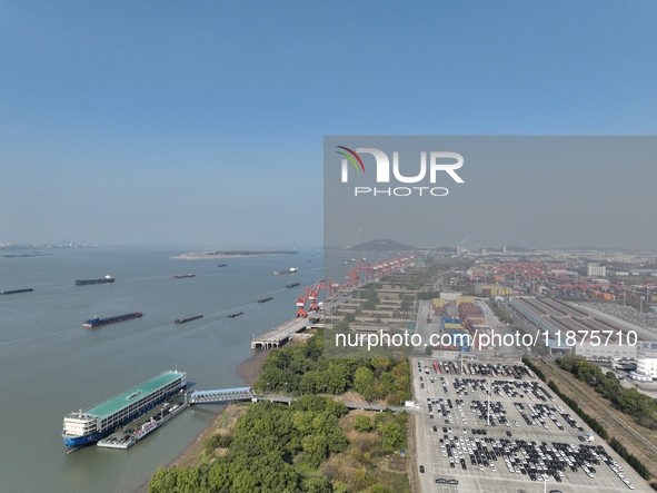 A ro-ro cargo ship loads Chery Group cars destined for the global market at Zhujiaqiao Port area of Anhui Port Group in Wuhu, Anhui province...