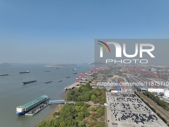 A ro-ro cargo ship loads Chery Group cars destined for the global market at Zhujiaqiao Port area of Anhui Port Group in Wuhu, Anhui province...