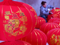 A worker makes red lanterns in Handan, China, on December 17, 2024. (